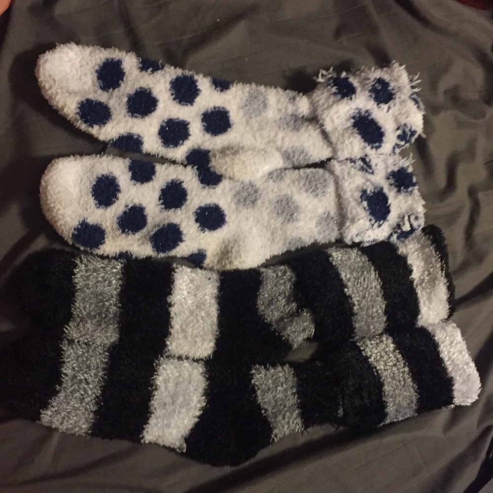 Two pairs of long fuzzy socks.